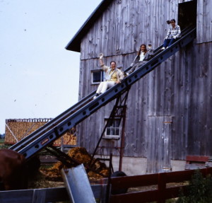 Finished mowing hay bales, side view, 1969