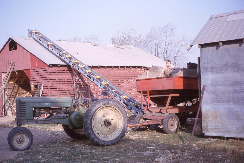 Ralph in wagon, loading corncrib, 1963-64