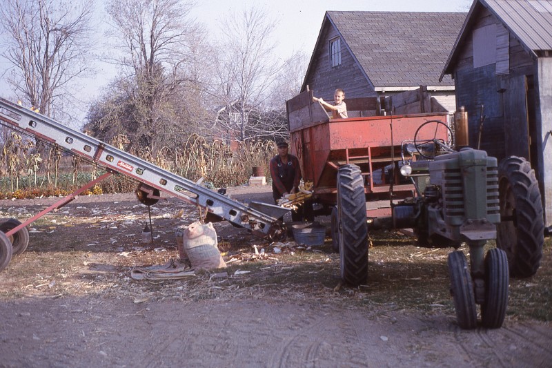 Ernie and Ralph loading corncrib, 1963-64