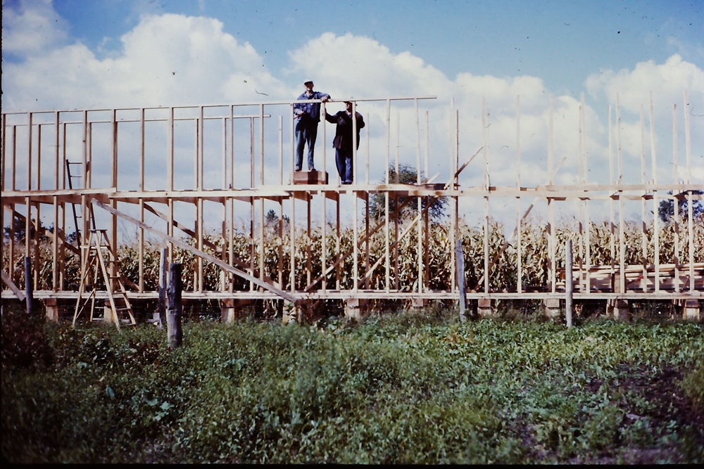 My Dad, Walter Roadhouse, with Ernie Roadhouse building our field corncrib