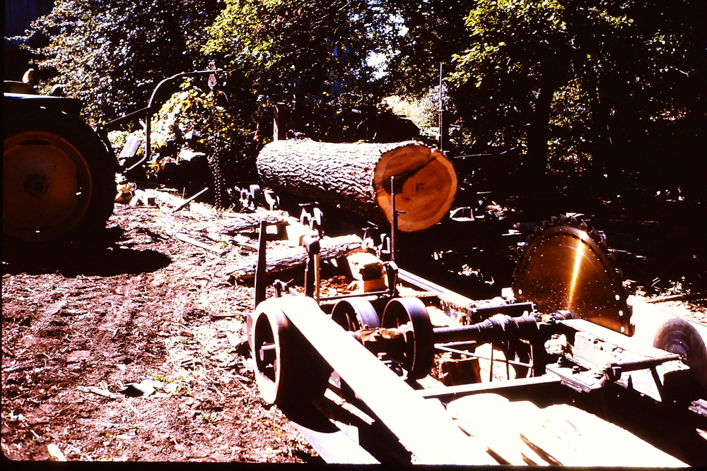 Ernie Roadhouse using his saw mill to cut our corncrib lumber
